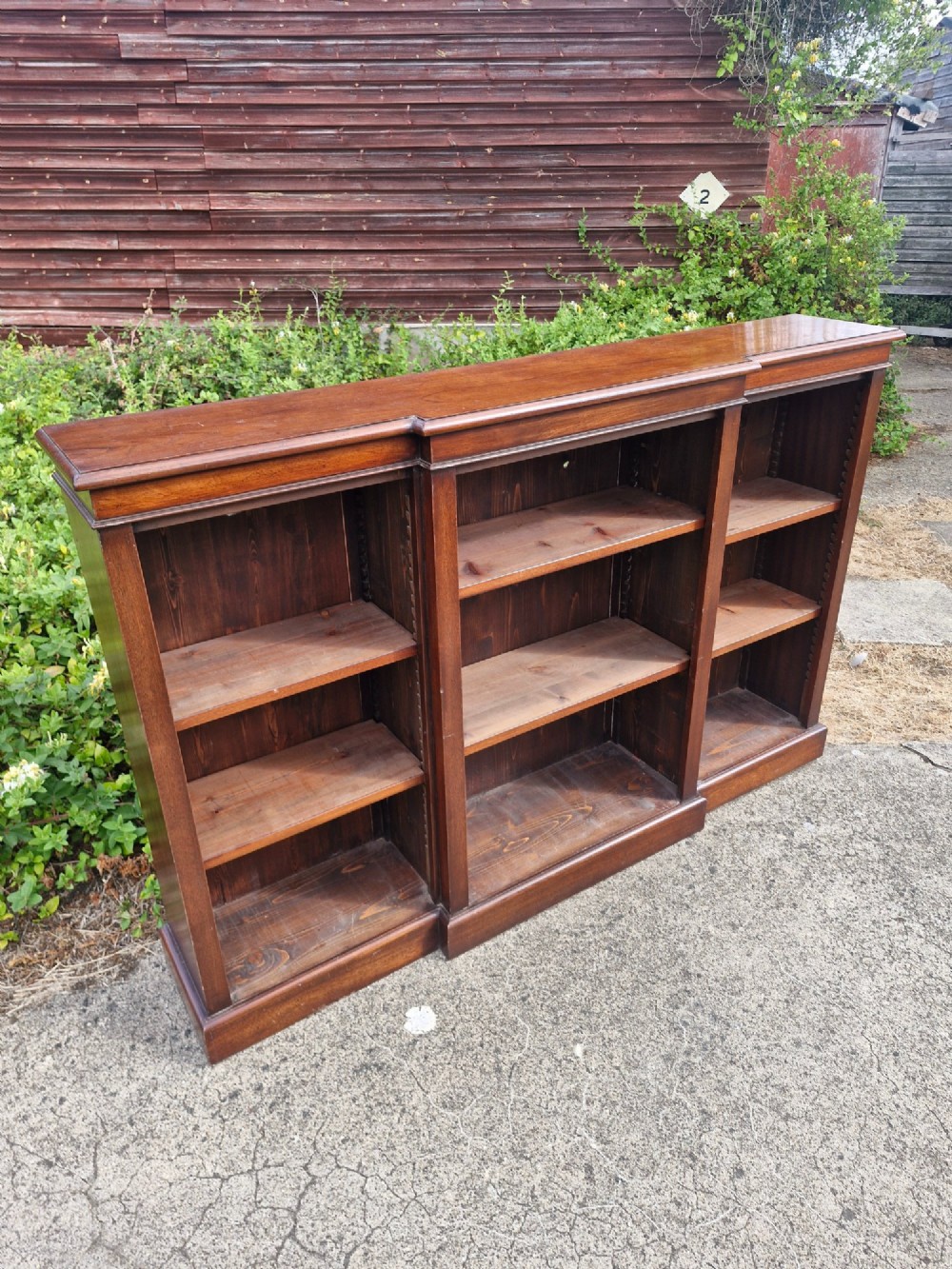 Mahogany breakfront front open bookcase.