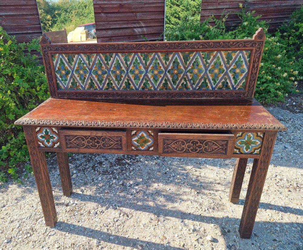 Late Victorian oak 2 drawer side table with decorative tiles. View V