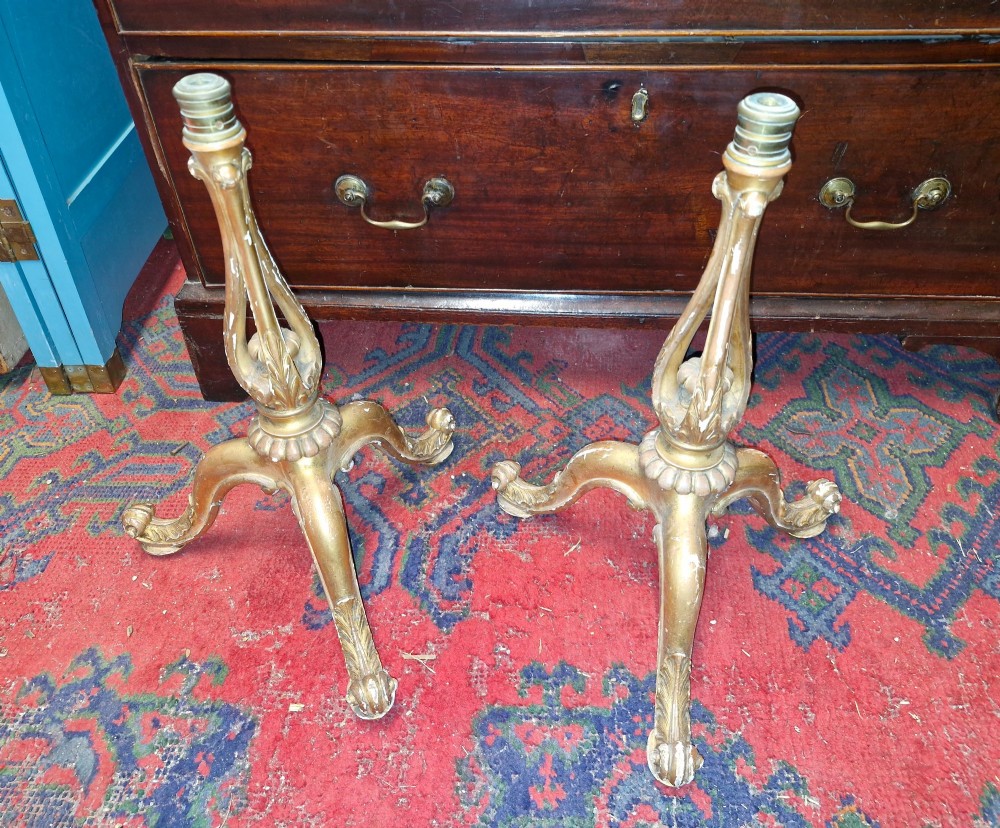 A pair of carved wood tripod bases featuring aged gold leaf gilding, scrolled tripod legs, and acanthus leaf carving. View IV