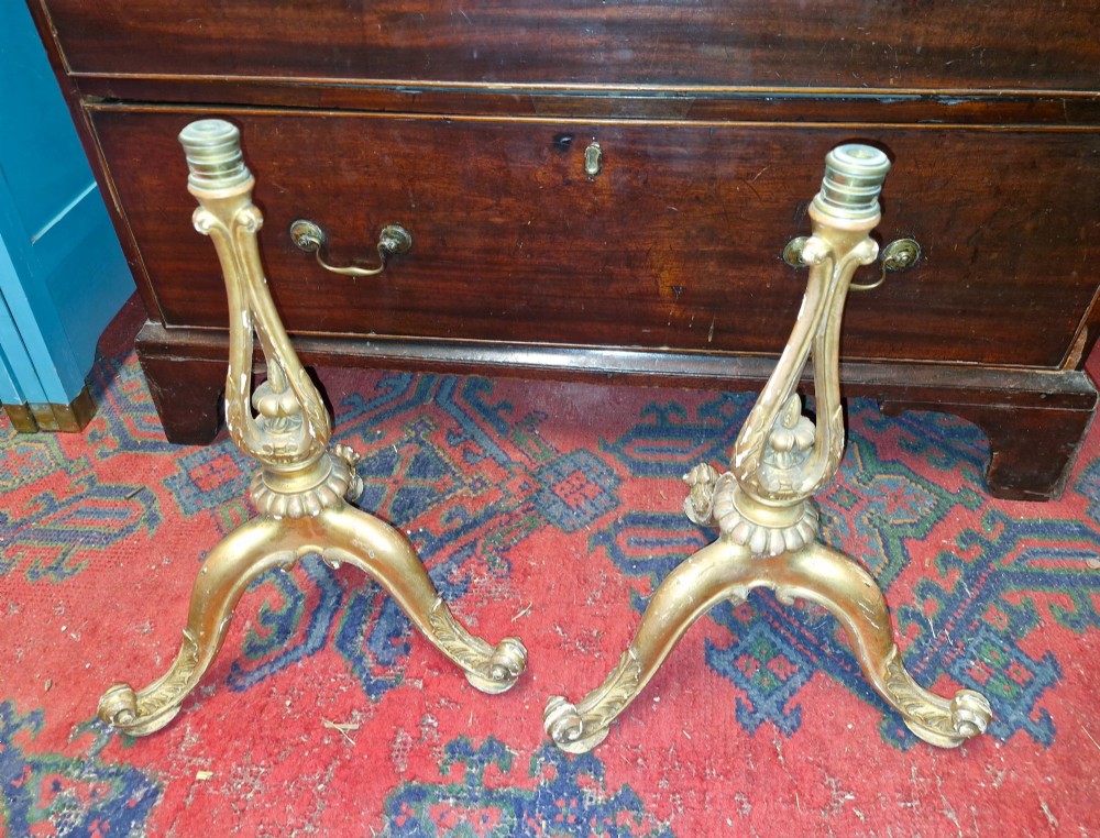 A pair of carved wood tripod bases featuring aged gold leaf gilding, scrolled tripod legs, and acanthus leaf carving. View VIII