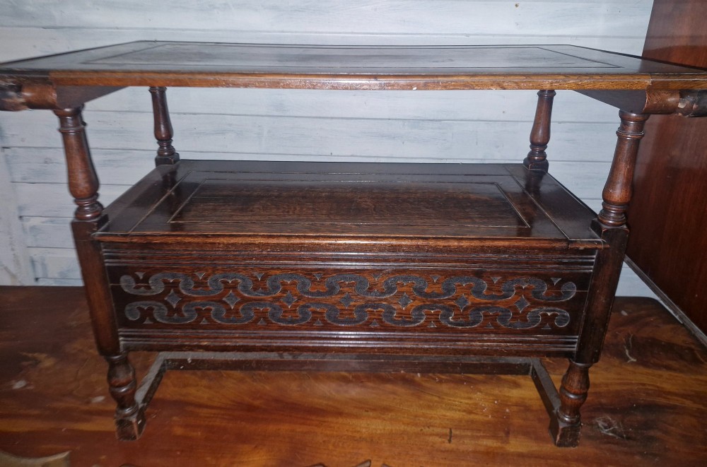 A dark oak monks bench featuring a carved diamond-patterned backrest, turned arm supports, carved front panel, and a lift-up seat. View IV