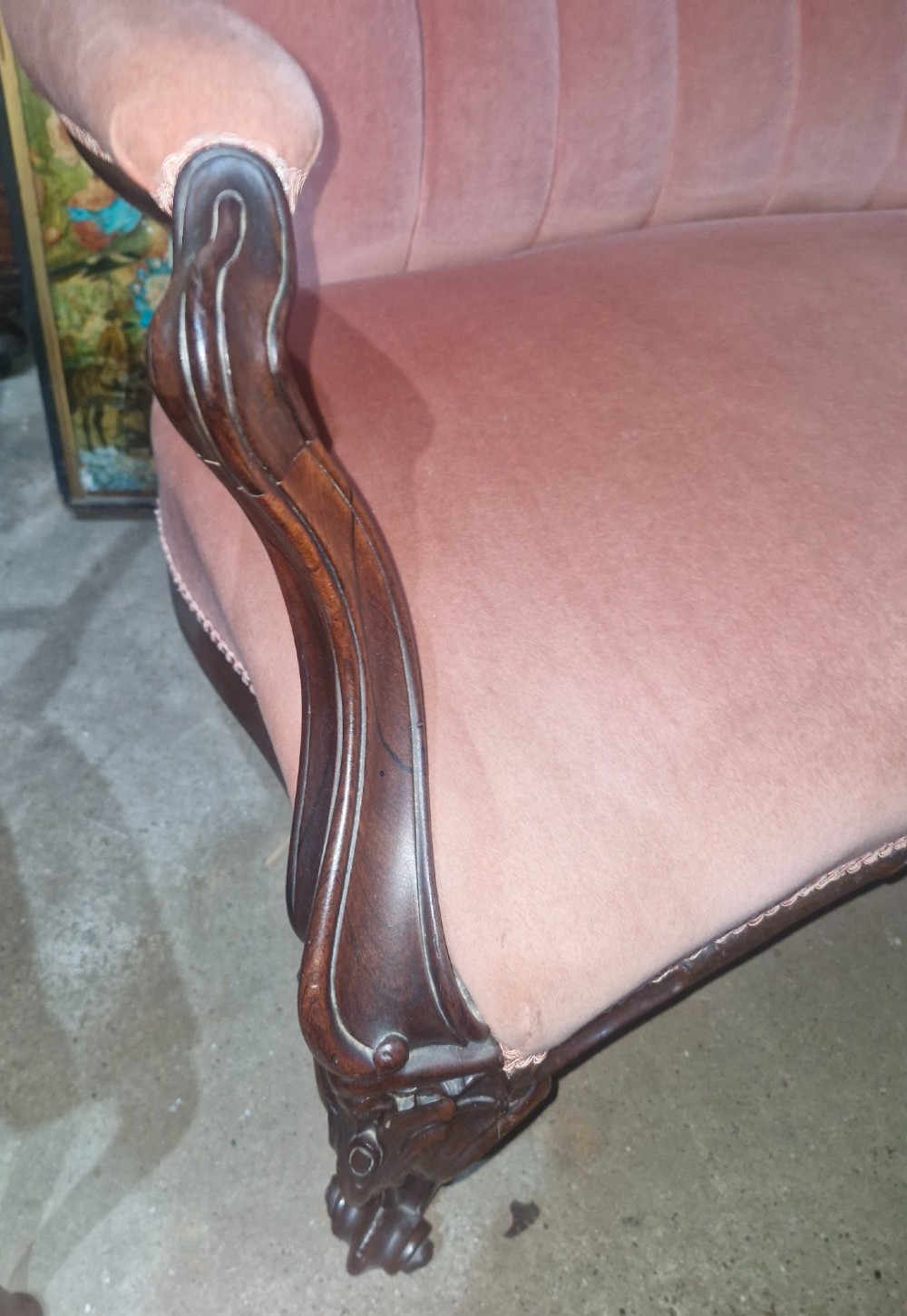 Mid-Victorian carved rosewood settee featuring button-tufted dusky pink velvet upholstery, serpentine backrest, and carved cabriole legs. View II