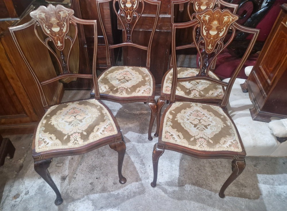 A set of four Edwardian mahogany side chairs featuring inlaid vasiform splats, cabriole front legs, and pattern-upholstered seats. View II