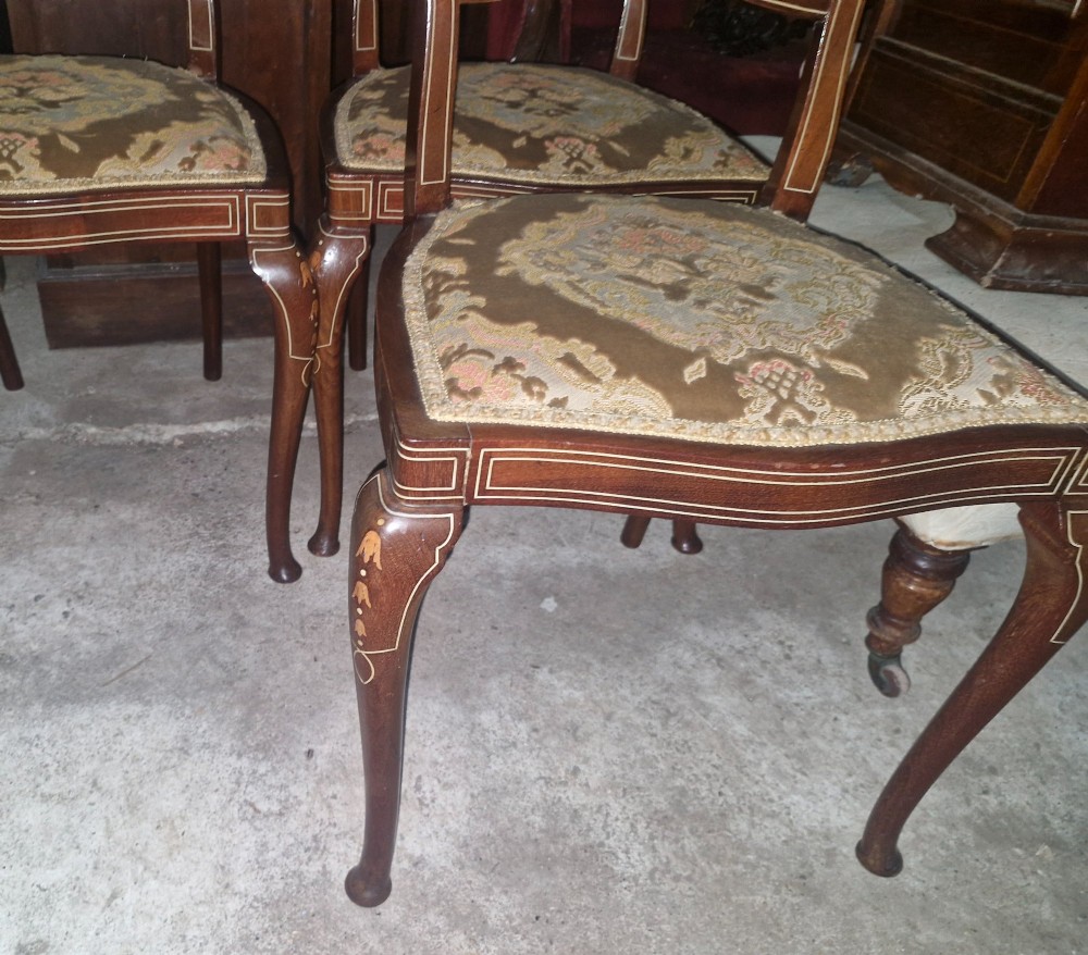 A set of four Edwardian mahogany side chairs featuring inlaid vasiform splats, cabriole front legs, and pattern-upholstered seats. View IV
