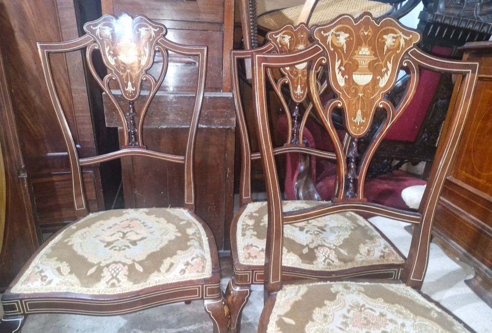 A set of four Edwardian mahogany side chairs featuring inlaid vasiform splats, cabriole front legs, and pattern-upholstered seats. View VII