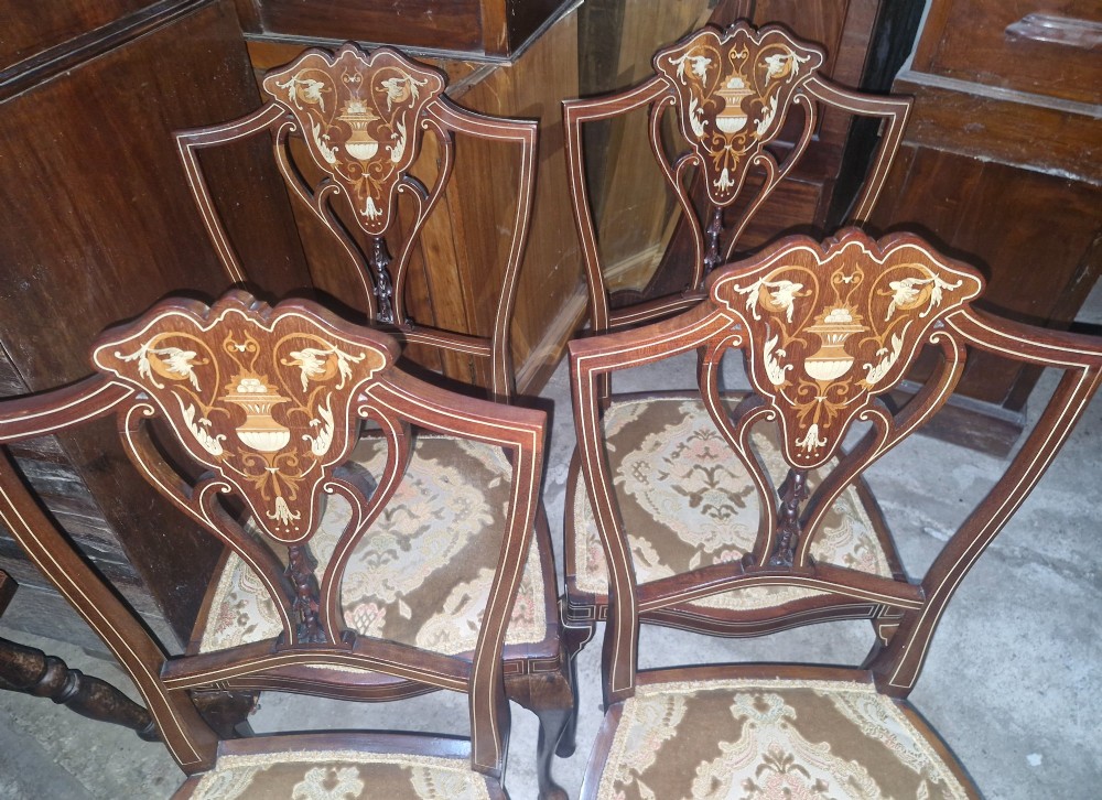 A set of four Edwardian mahogany side chairs featuring inlaid vasiform splats, cabriole front legs, and pattern-upholstered seats. View IX