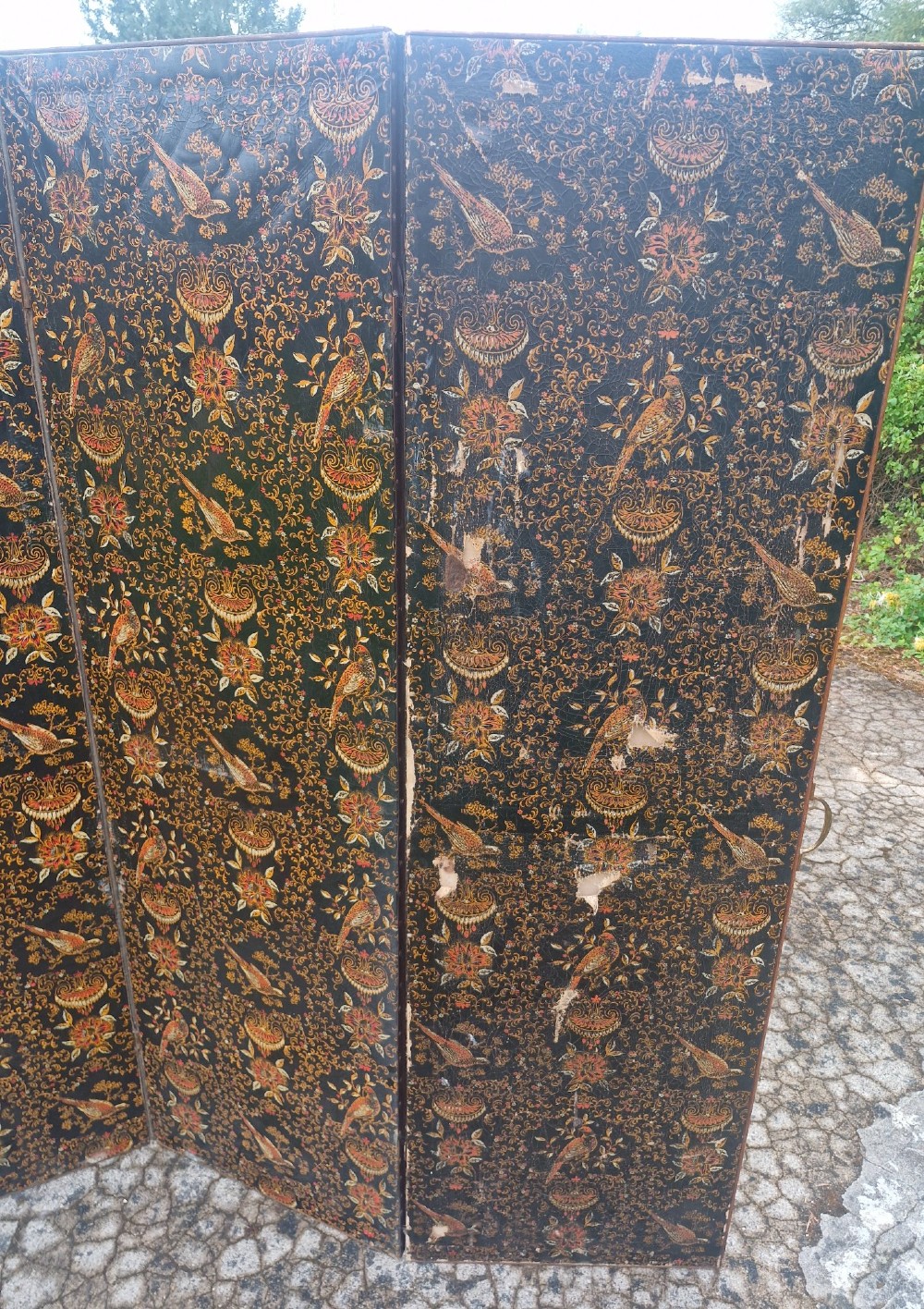 A late Victorian four-panel folding screen made of painted canvas featuring repeating golden bird and floral patterns on a dark black background. View VI