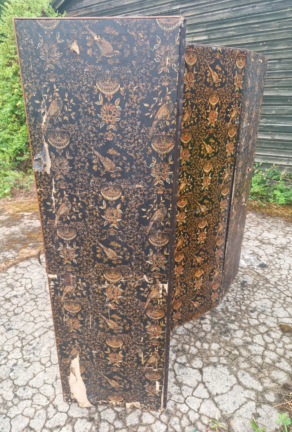 A late Victorian four-panel folding screen made of painted canvas featuring repeating golden bird and floral patterns on a dark black background. View VII