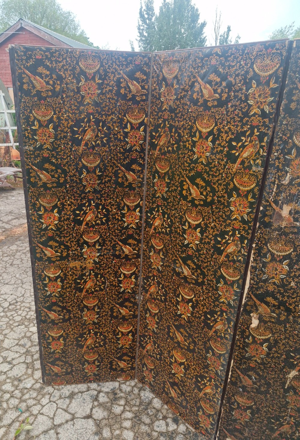 A late Victorian four-panel folding screen made of painted canvas featuring repeating golden bird and floral patterns on a dark black background. View X