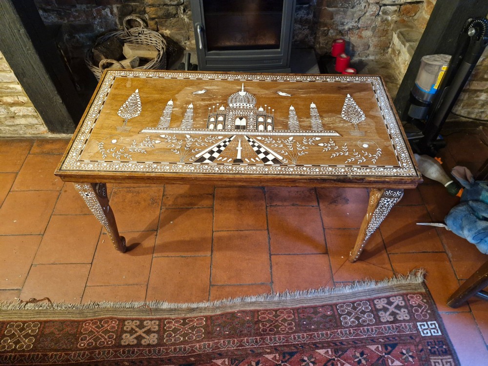 A rectangular warm brown hardwood table featuring detailed white bone inlay depicting the Taj Mahal surrounded by floral borders and curved inlaid legs. View II