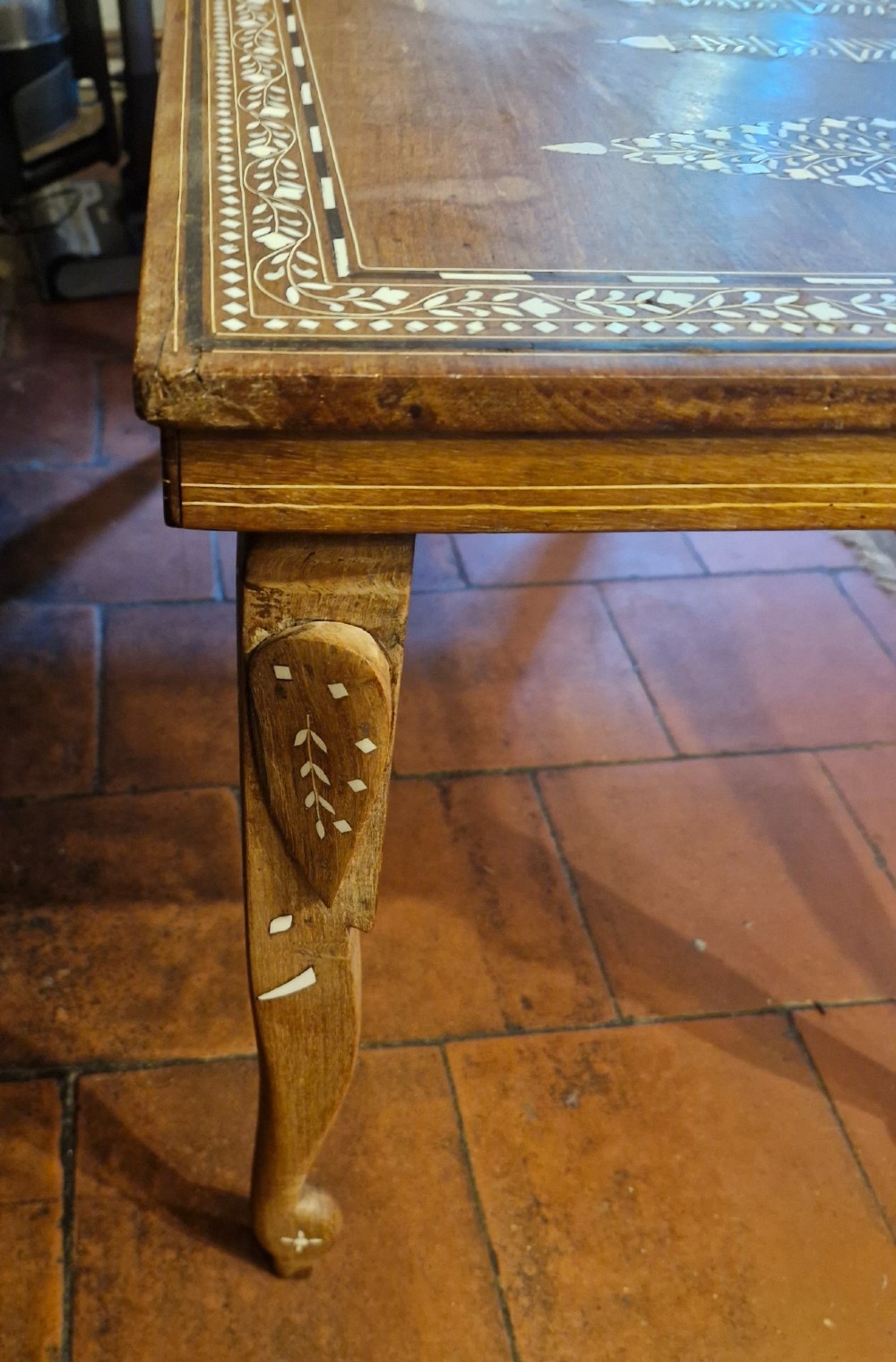 A rectangular warm brown hardwood table featuring detailed white bone inlay depicting the Taj Mahal surrounded by floral borders and curved inlaid legs. View IV