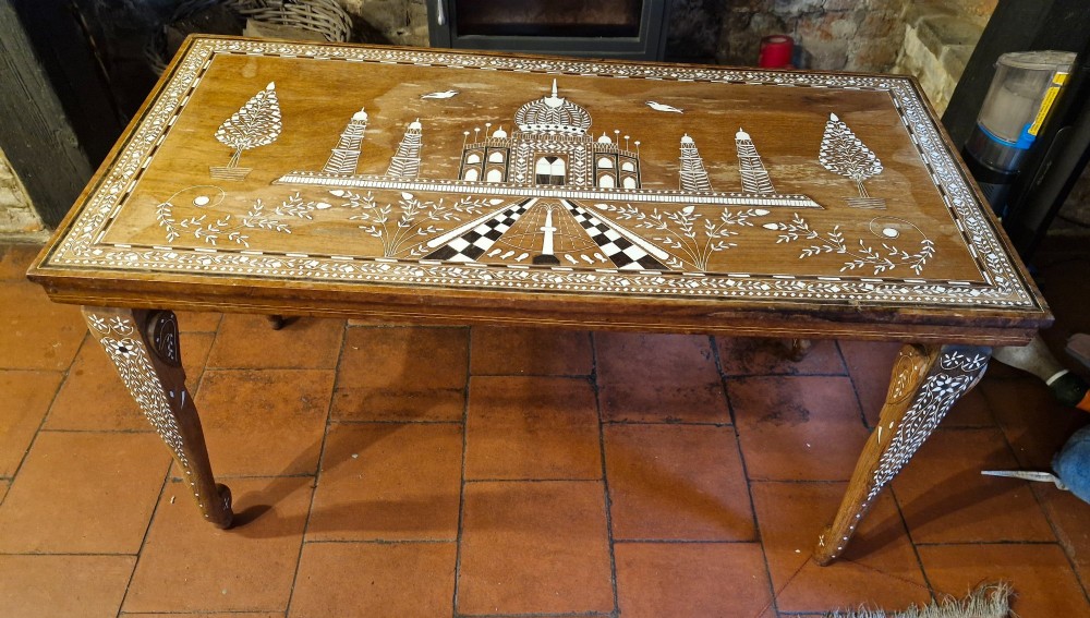 A rectangular warm brown hardwood table featuring detailed white bone inlay depicting the Taj Mahal surrounded by floral borders and curved inlaid legs. View VIII