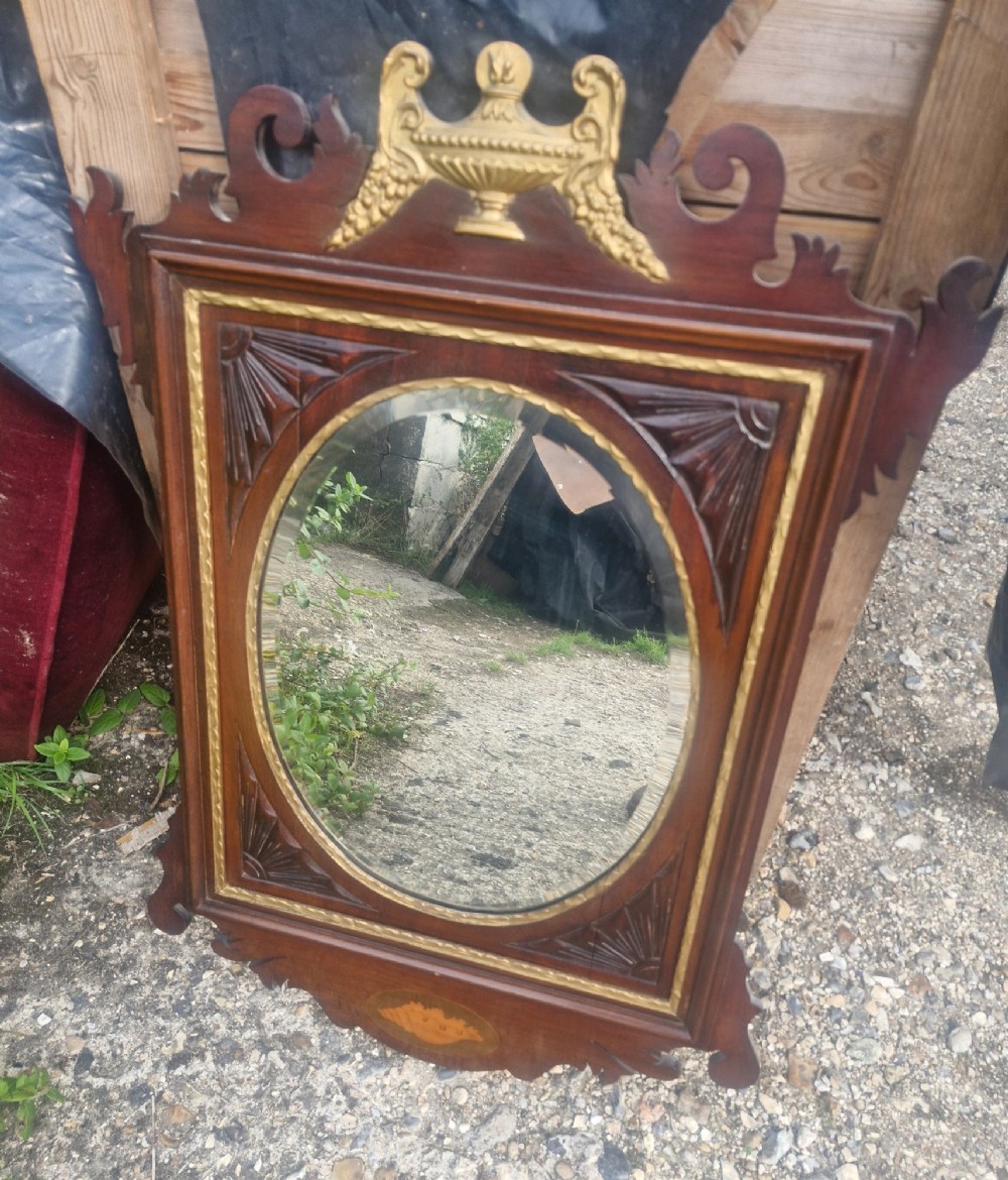 Mahogany and gilt framed wall mirror.