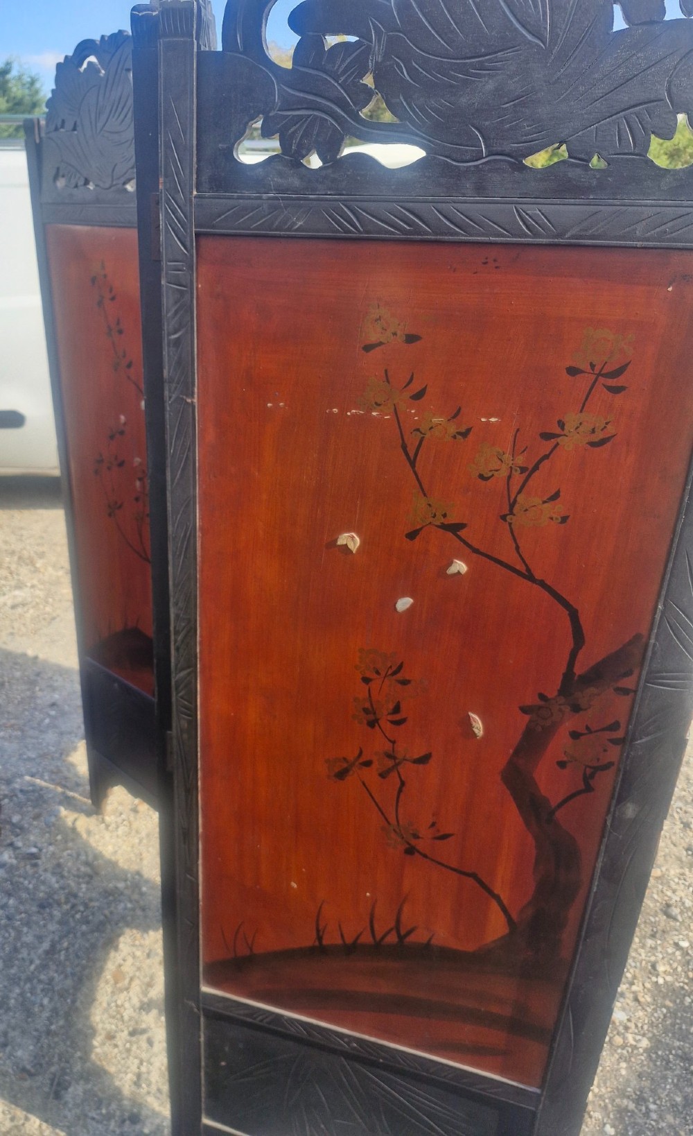 A four-panel dark wood folding screen featuring carved openwork top crests and central dark panels with raised bone inlays depicting birds among flowering branches. View VIII