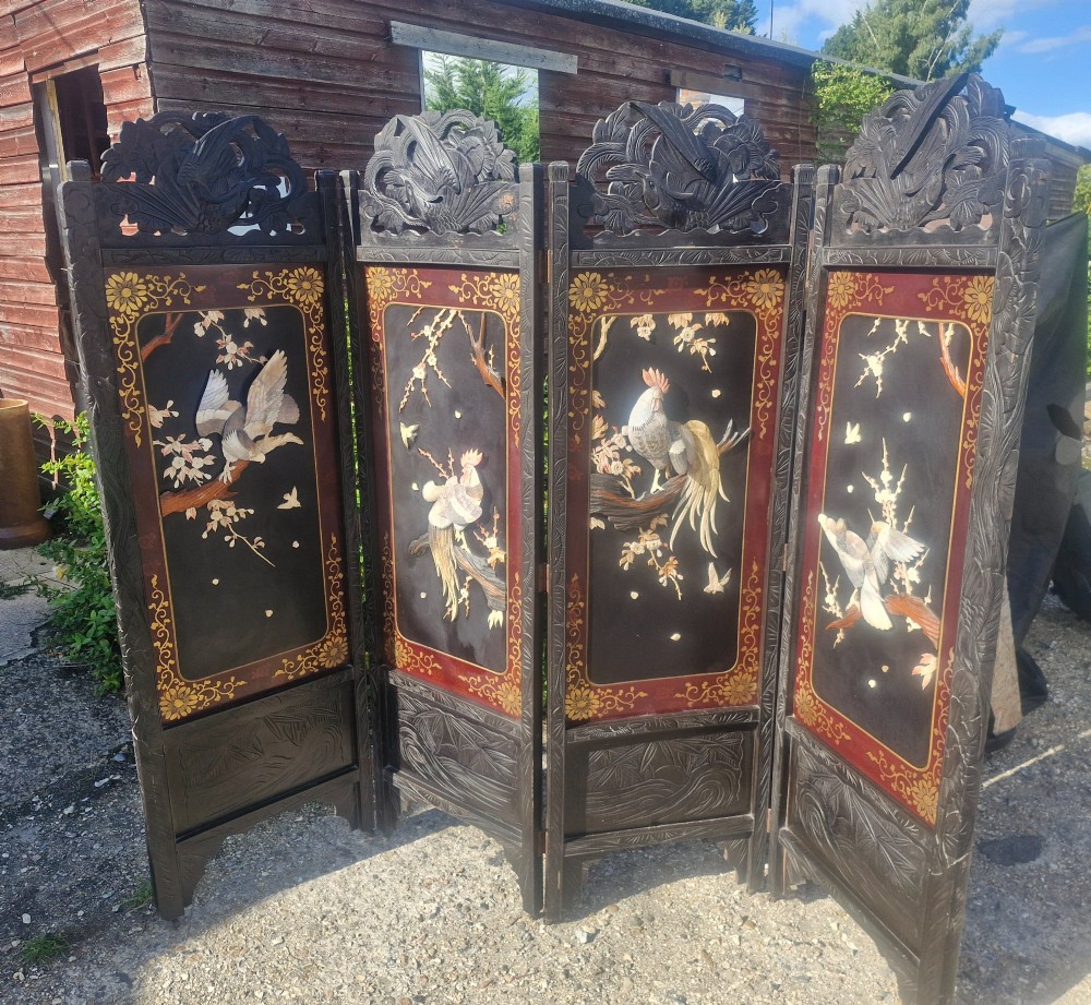 A four-panel dark wood folding screen featuring carved openwork top crests and central dark panels with raised bone inlays depicting birds among flowering branches. View IX