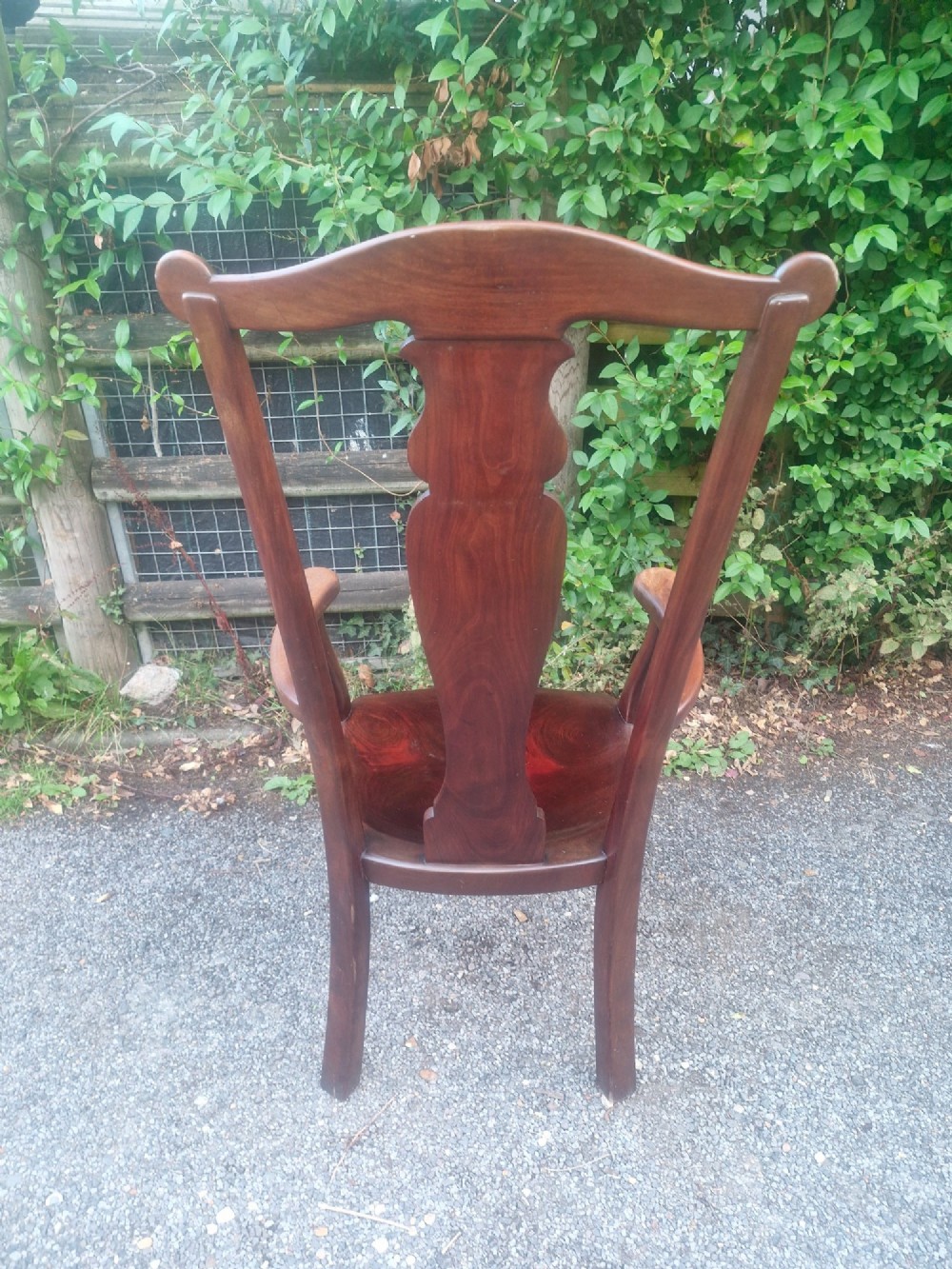 A high-backed solid mahogany armchair featuring a contoured vasiform splat back, shaped armrests, solid timber seat, and cabriole front legs. View IV