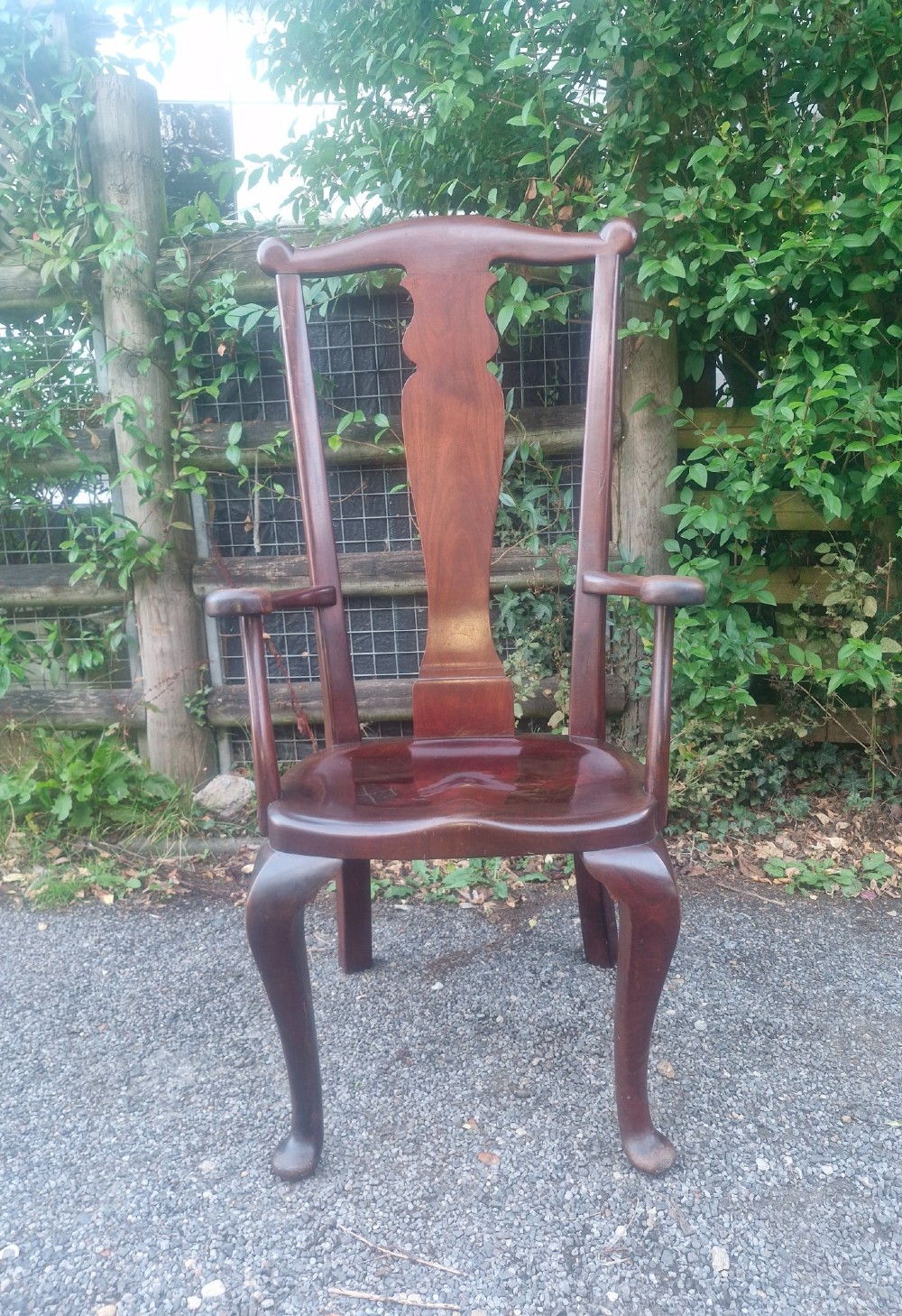 A high-backed solid mahogany armchair featuring a contoured vasiform splat back, shaped armrests, solid timber seat, and cabriole front legs. View VI