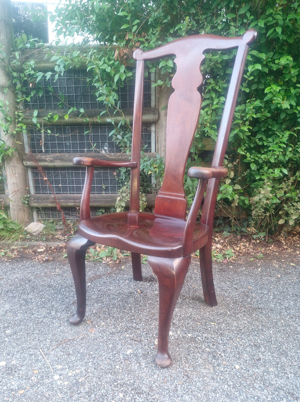A high-backed solid mahogany armchair featuring a contoured vasiform splat back, shaped armrests, solid timber seat, and cabriole front legs. View XI
