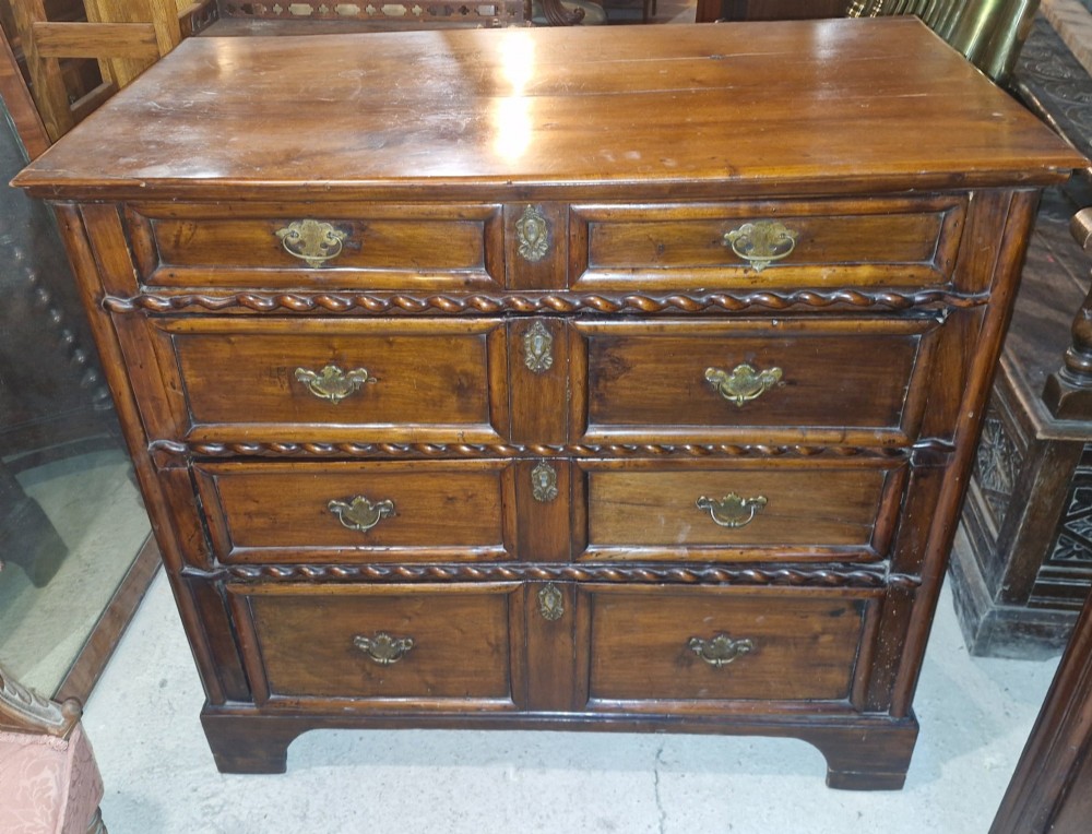 Antique walnut chest of drawers.