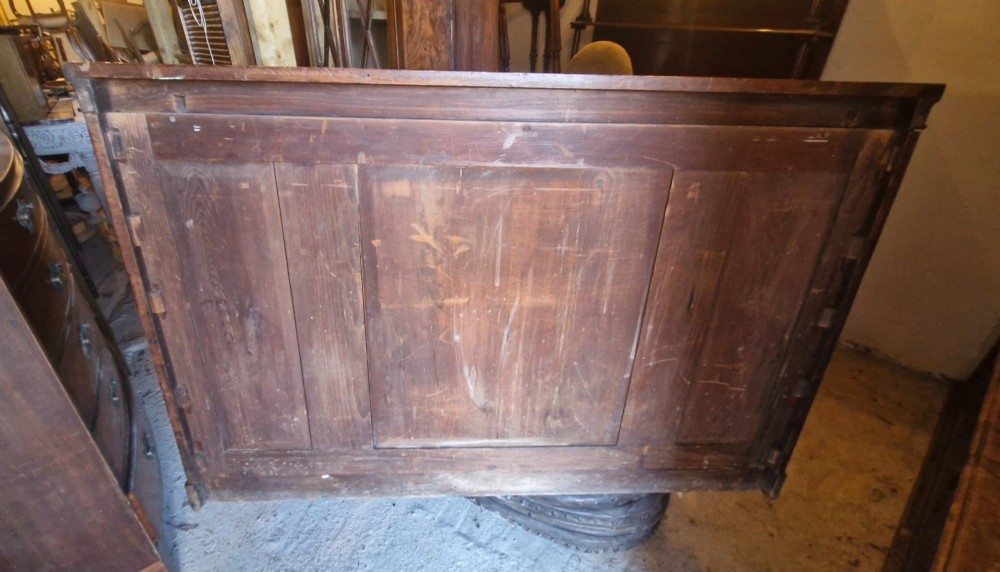 A mid-19th-century mahogany open-front bookcase featuring a three-bay breakfront design and adjustable shelves set on a solid plinth base. View III