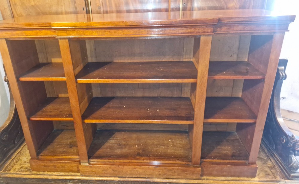 A mid-19th-century mahogany open-front bookcase featuring a three-bay breakfront design and adjustable shelves set on a solid plinth base. View IV