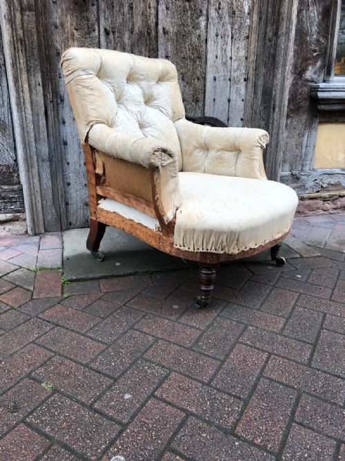 A 19thc Turned Legs Country House Armchair by Howard and Sons