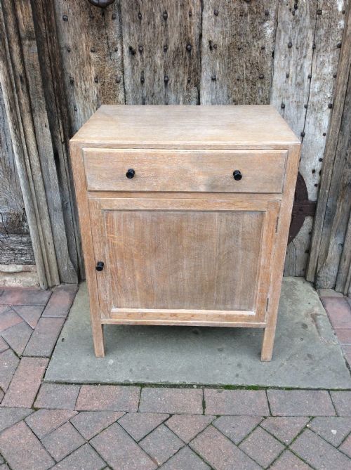 A 20thc Light Oak Heals Cupboard