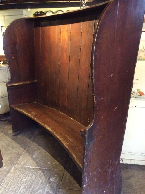 A  19thc Curved High Back Stained Pine Settle