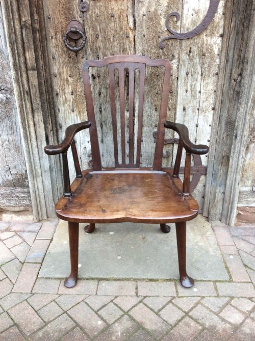 A 19thc Mahogany Broad Seated Open Armchair on Pad Feet