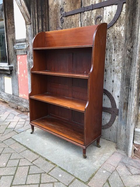 An Early 19th Century Mahogany and Ebony Strung Waterfall Bookcase, English Circa 1800