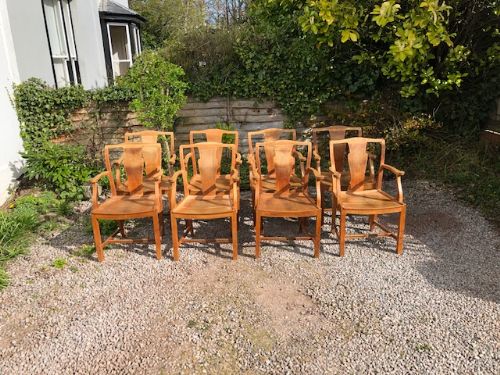 A Set of 8 Heals Light Oak Armchairs