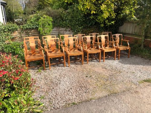 A Set of 12 Heals Light Oak Armchairs