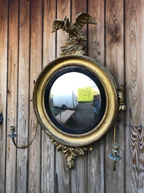 A Regency Carved and Gilded Convex Mirror