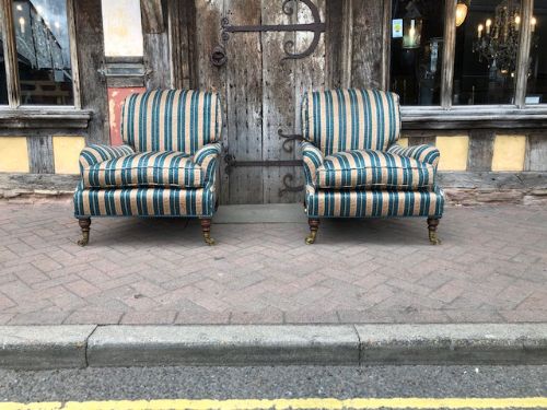 A Pair of 19thc Walnut Leg Upholstered Grafton Model Howard and Sons Armchairs
