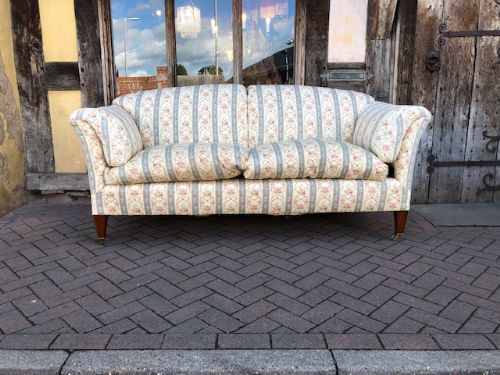 An Early 20th Century Howard & Sons Portarlington Model 7ft Sofa.