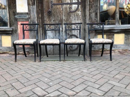 A Set of Four 19thc Ebonised Sabre Leg Chairs