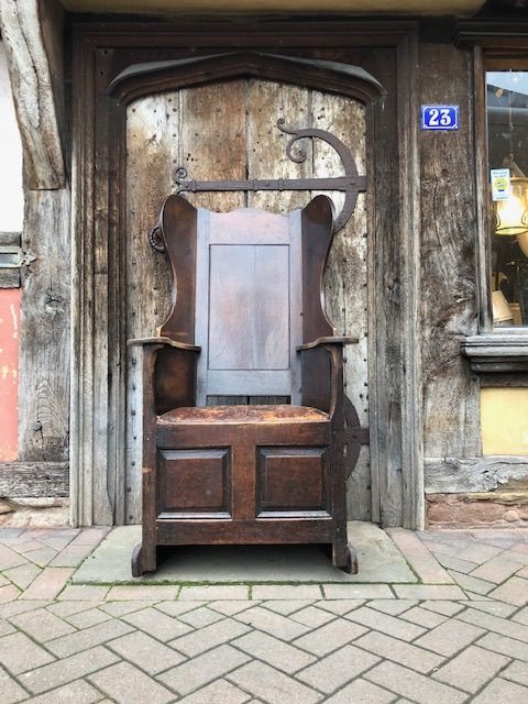 An 18thc  Oak Lambing Chair with a Lovely Worn Leather Seat