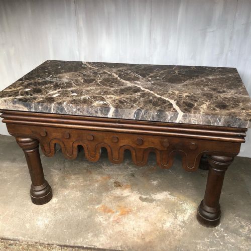fig 1. A mid-19th century oak and marble side table in the Neo-Norman taste