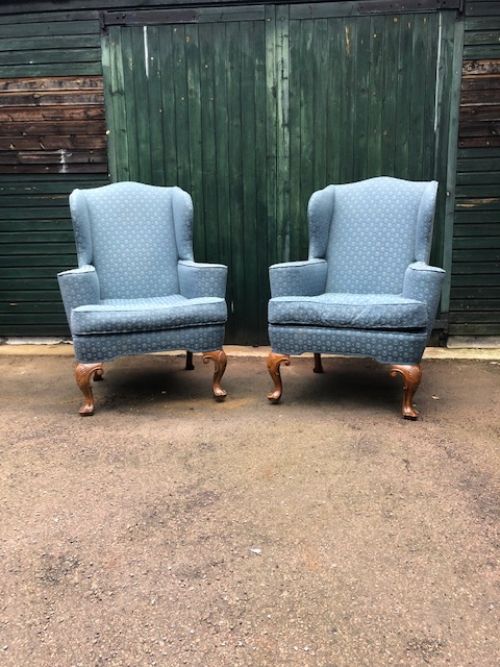 A Pair of Early 20th Century Mahogany Cabriole Leg Wing Armchairs