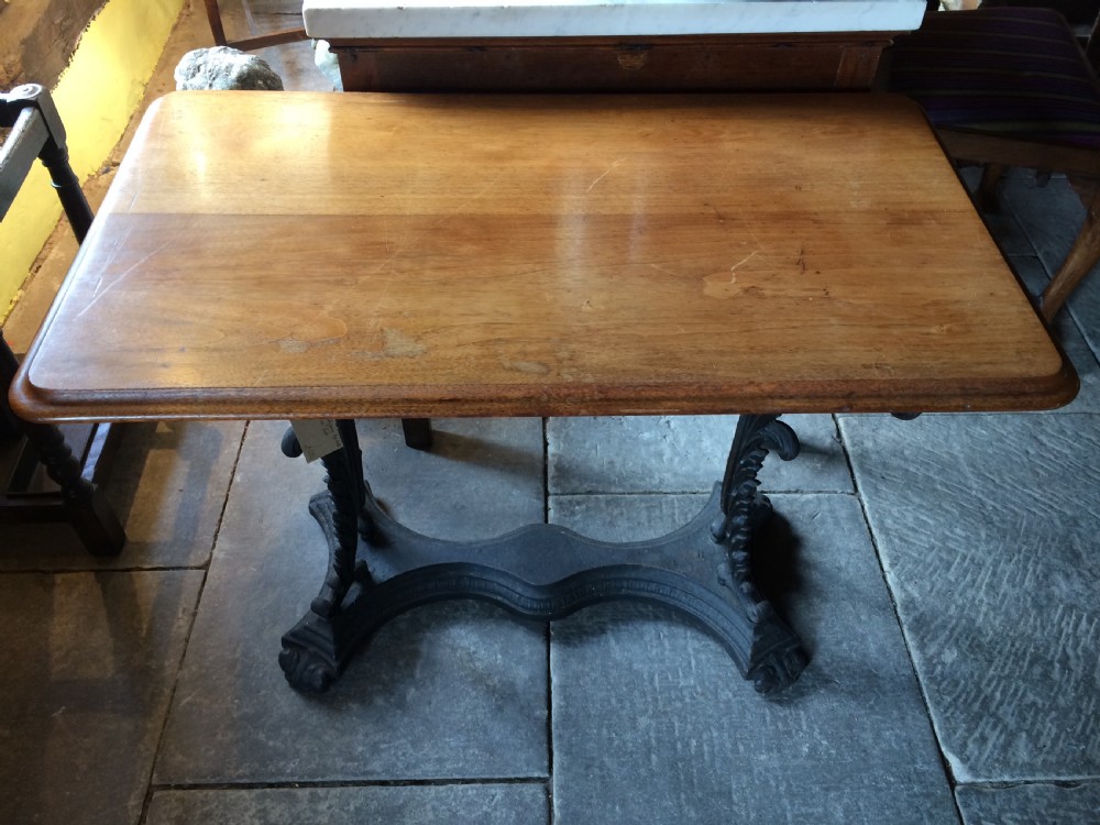 19th C Mahogany top table on cast iron base. View IV