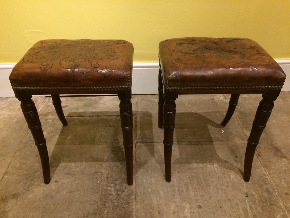 18thC Pair of mahogany sabre leg and embossed leather stools View II