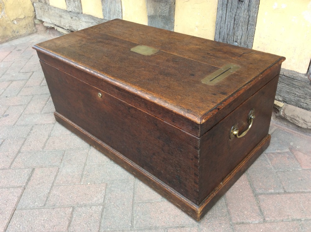 19thC Oak box with brass handles, posting slot. Fitted with a Bramah lock View IV