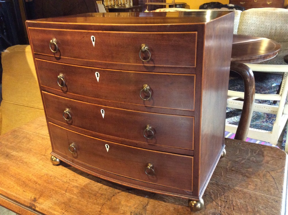 Regency Mahogany Bow front miniature chest of drawers View II