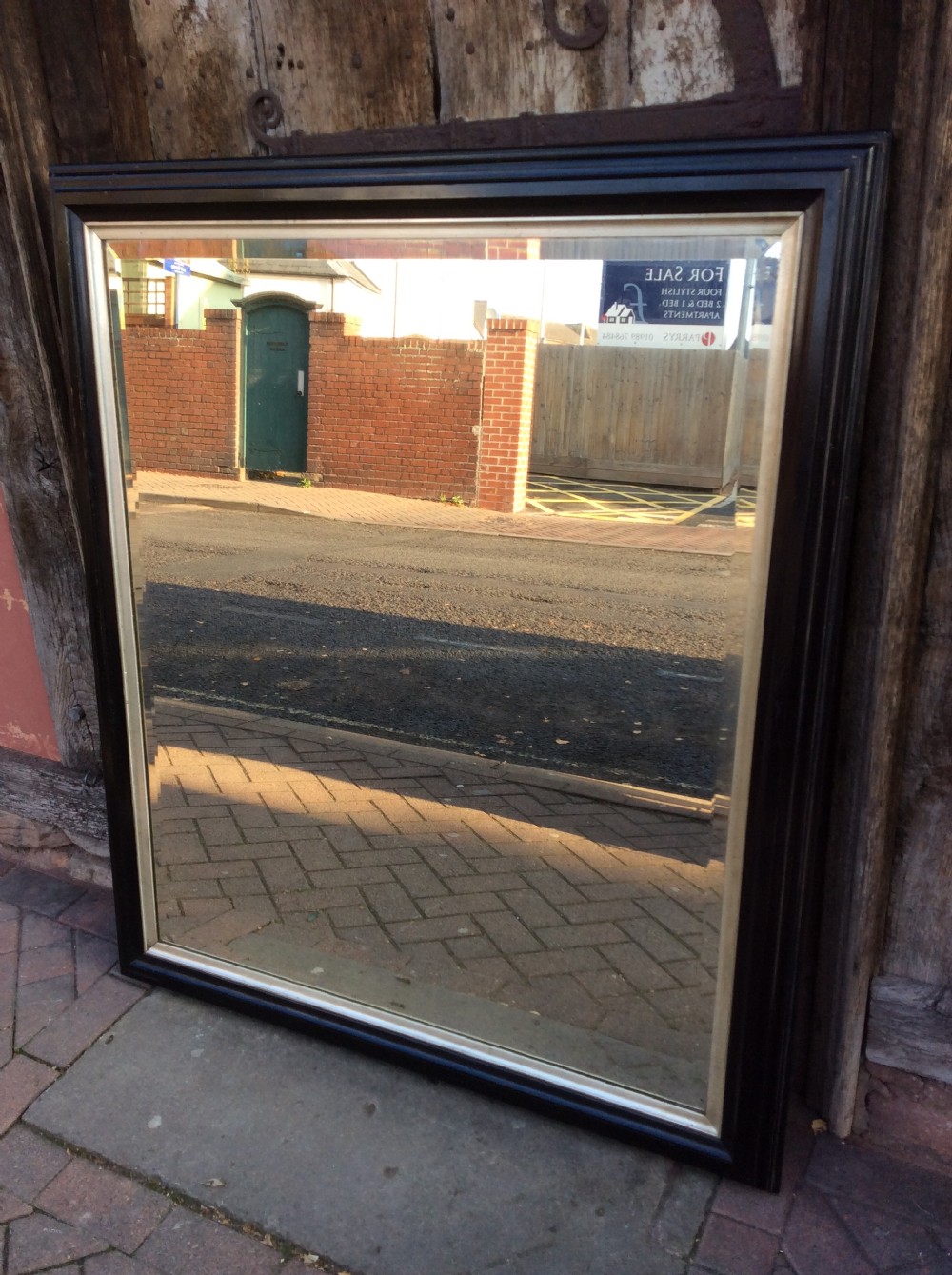 19thC Ebonised bevelled mirror