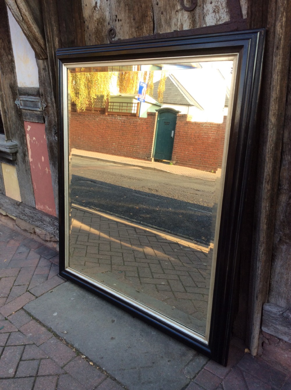 19thC Ebonised bevelled mirror View II