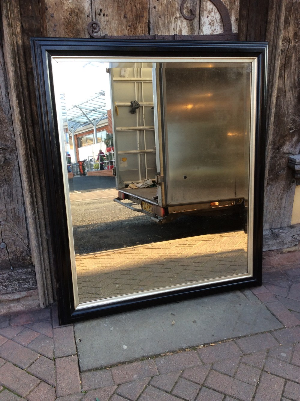 19thC Ebonised bevelled mirror View IV