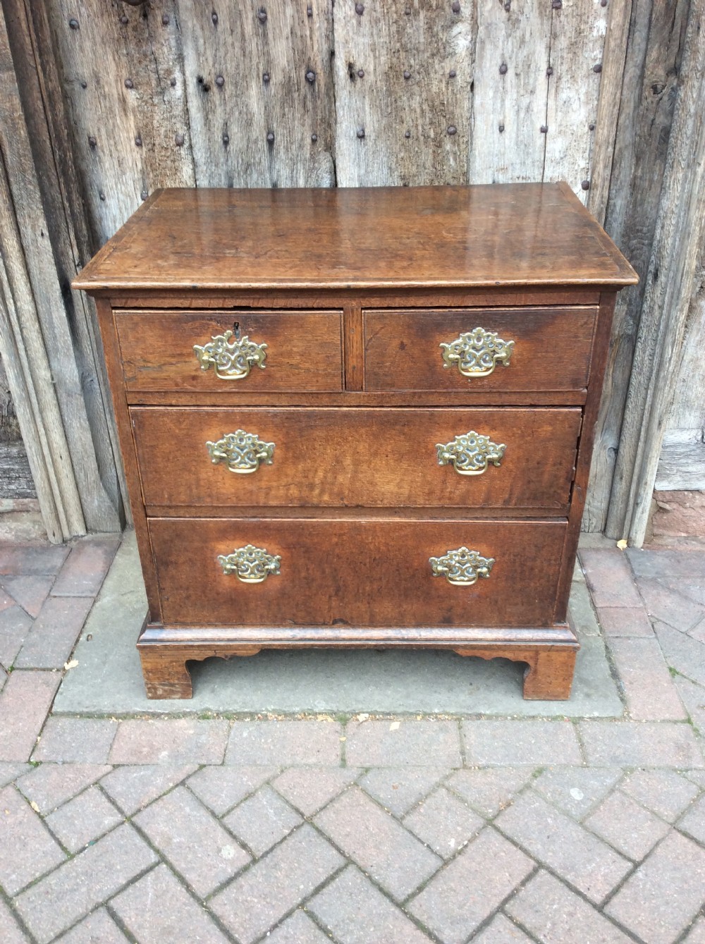18thC Oak small chest of 4 drawers on bracket feet View II