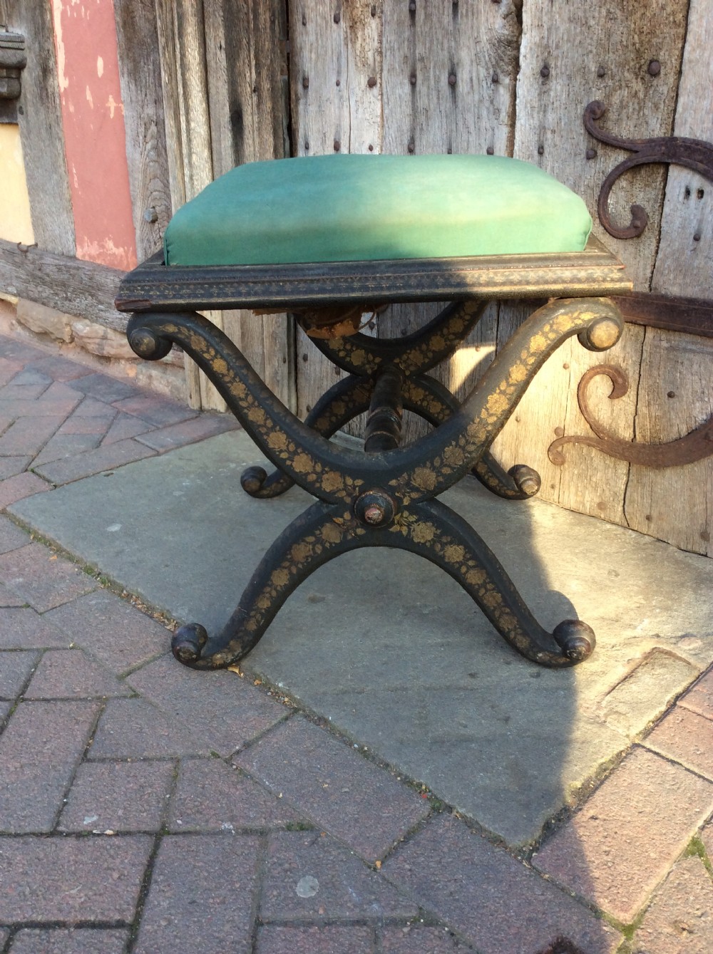 Early 19thC X framed ebonised and decorated stool