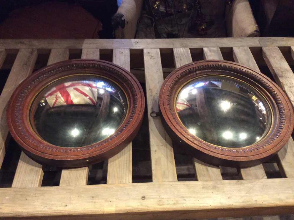 19thC Pair of oak convex mirrors View II