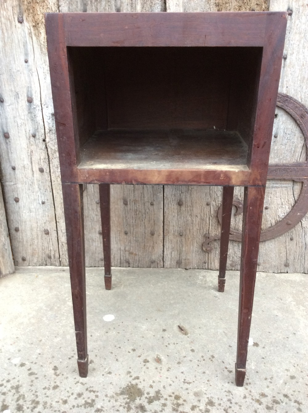 An 18th-century Georgian mahogany book table featuring a tray top gallery, an open compartment, and slender square tapered legs. View VIII